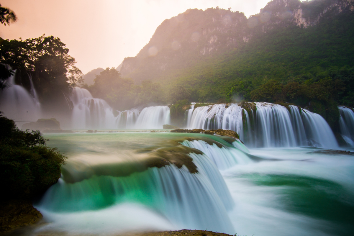 Ban Gioc Waterfall cascading through limestone cliffs near the Vietnam-China border